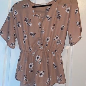 Nude pink top with floral design! Great for work or a day out with the fam!